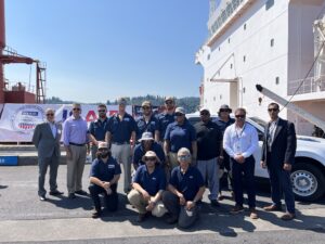 Crewmembers and Officers of the Liberty Glory pose for a photo shortly before departing the Longview Harbor to bring humanitarian aid to those in need (Photo Credit - American Maritime Congress)